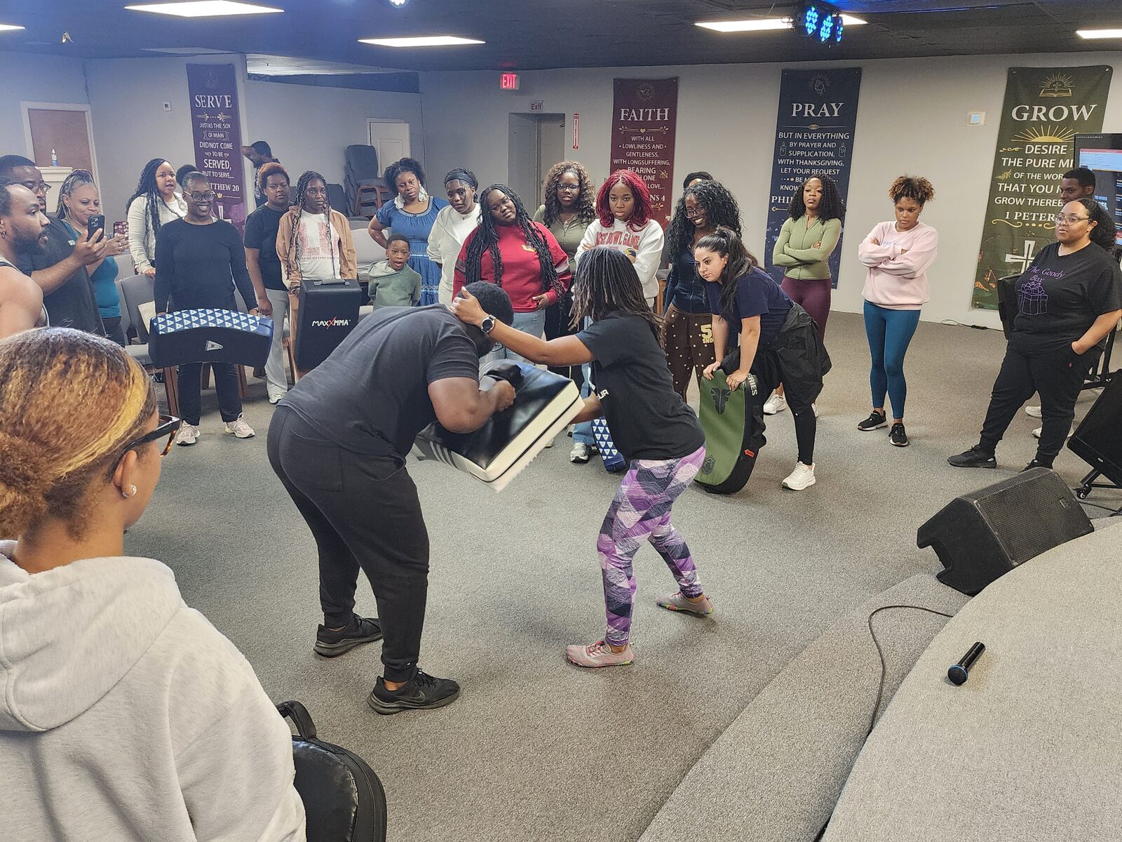 Hands-on self-defense demonstration during a LowKey Defense class